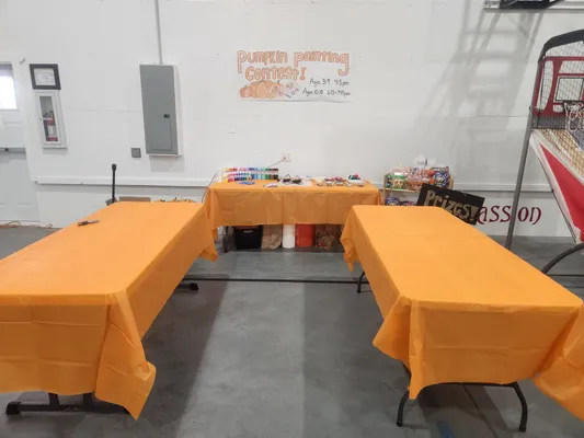 Youth painting pumpkins at Harvest Festival